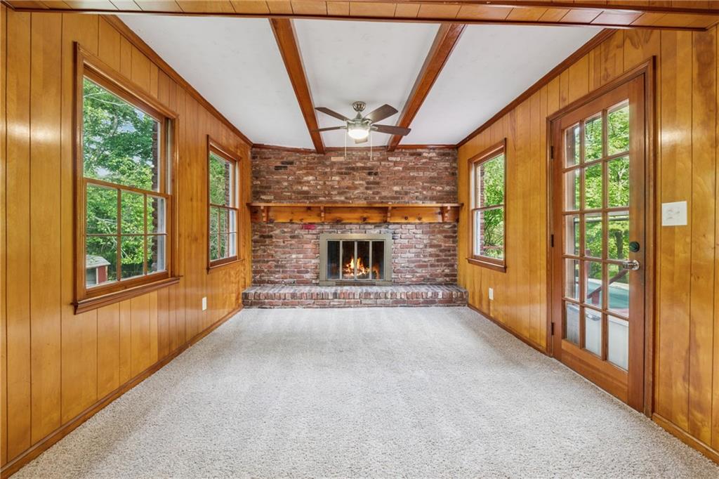 4616 Greensprings Road Atlanta, GA 30337 - Photo 7 of 26 a view of an empty room with a fireplace and a window