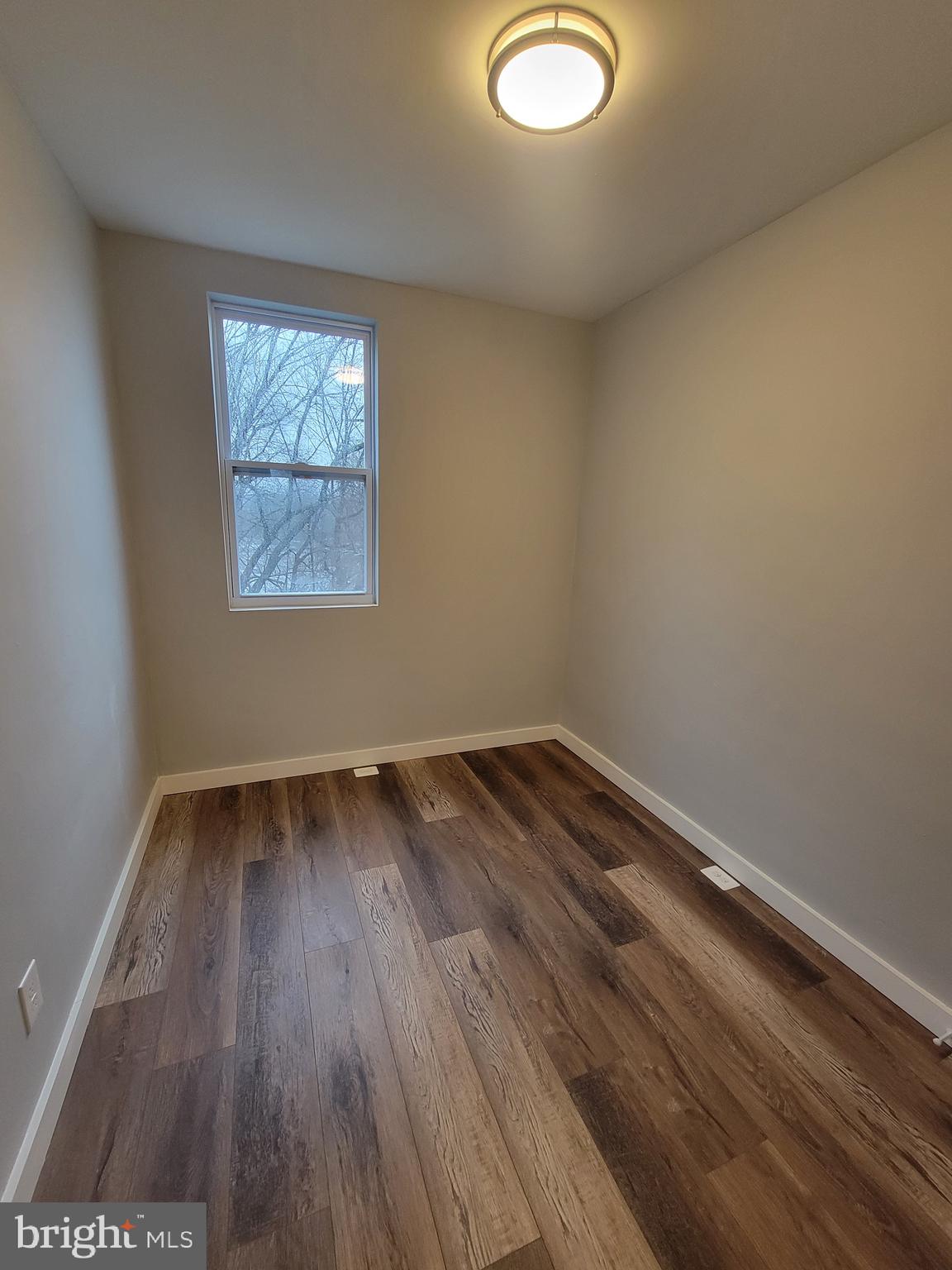 2896 Cushing Road Camden, NJ 08104 - Photo 15 of 31 a view of a room with wooden floor and window