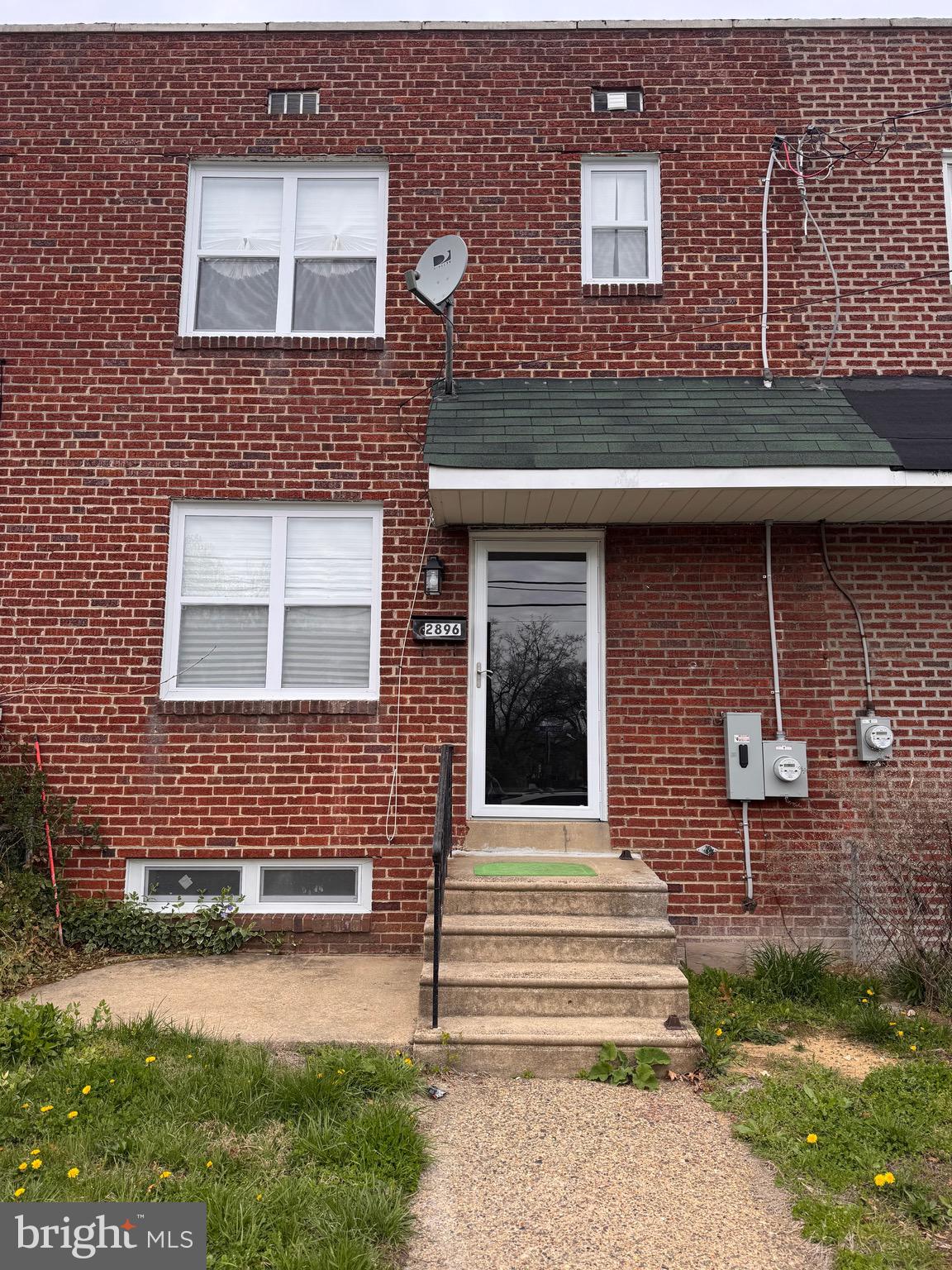 2896 Cushing Road Camden, NJ 08104 - Photo 2 of 31 a front view of a house with a garden and yard