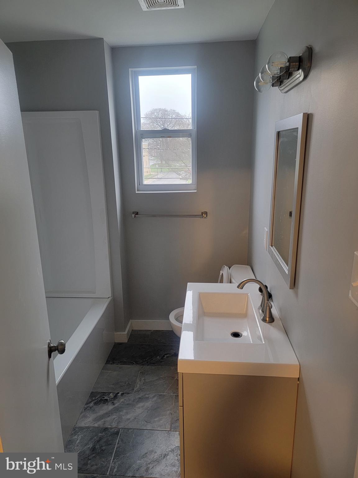 2896 Cushing Road Camden, NJ 08104 - Photo 21 of 31 a bathroom with a sink and a vanity