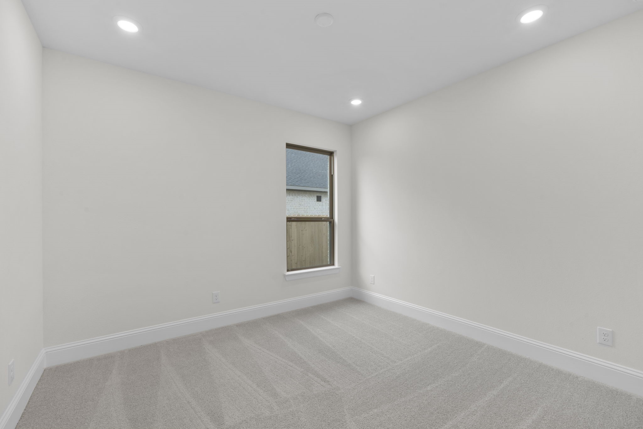 648 Cross Timbers Trace Hempstead, TX 77445 - Photo 12 of 40 a view of an empty room with window and cabinet