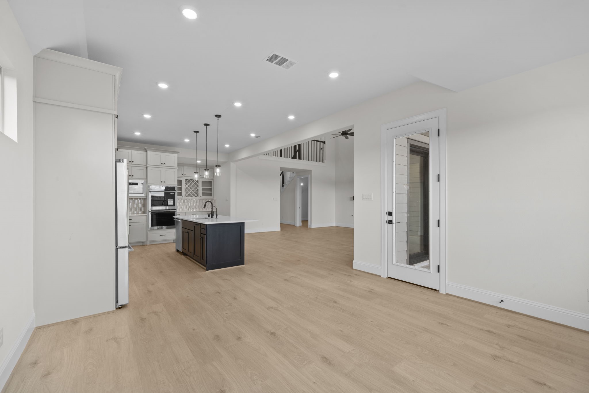648 Cross Timbers Trace Hempstead, TX 77445 - Photo 28 of 40 a kitchen with stainless steel appliances kitchen island granite countertop a refrigerator and a sink