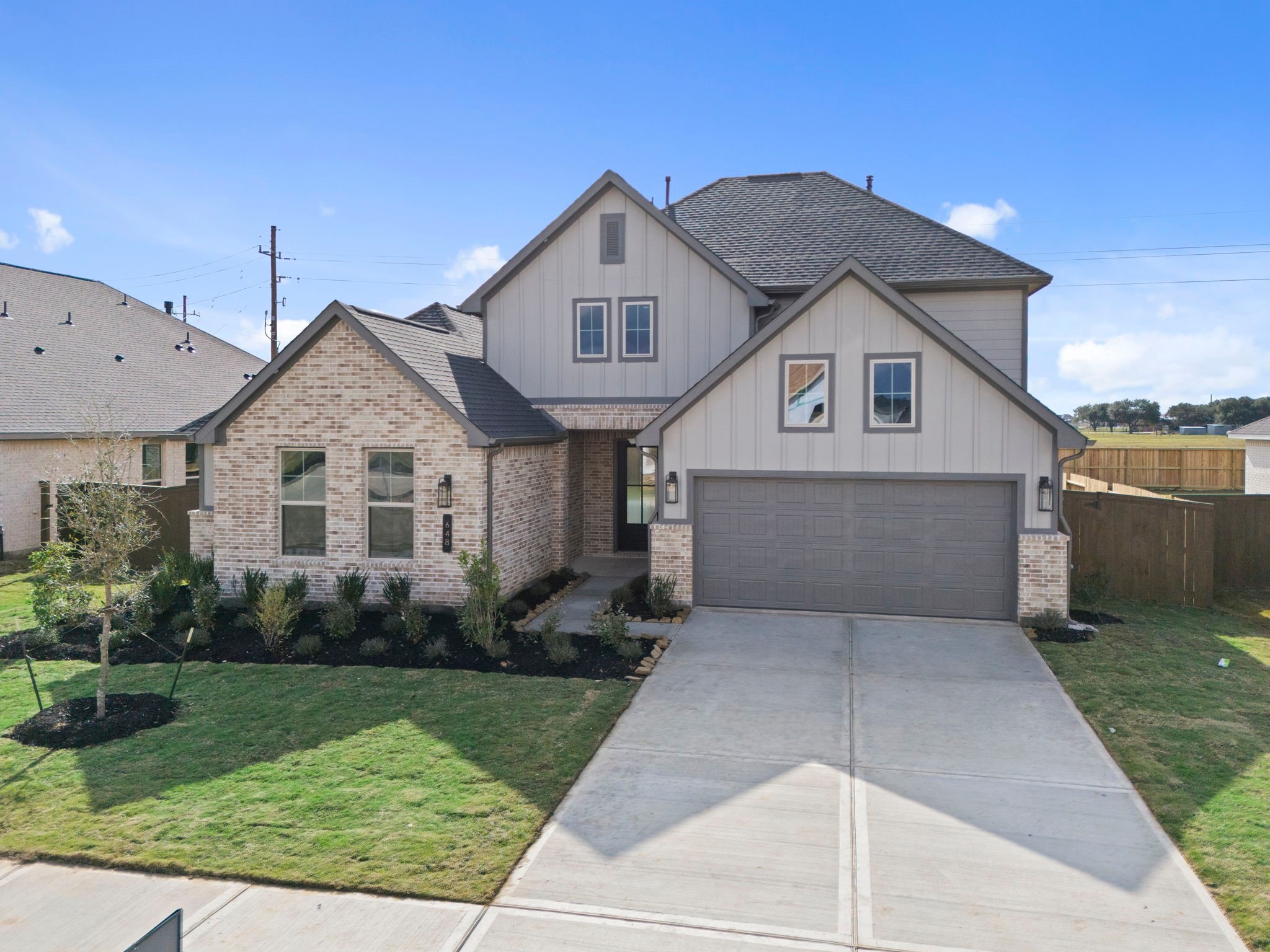 648 Cross Timbers Trace Hempstead, TX 77445 - Photo 36 of 40 a front view of a house with garden