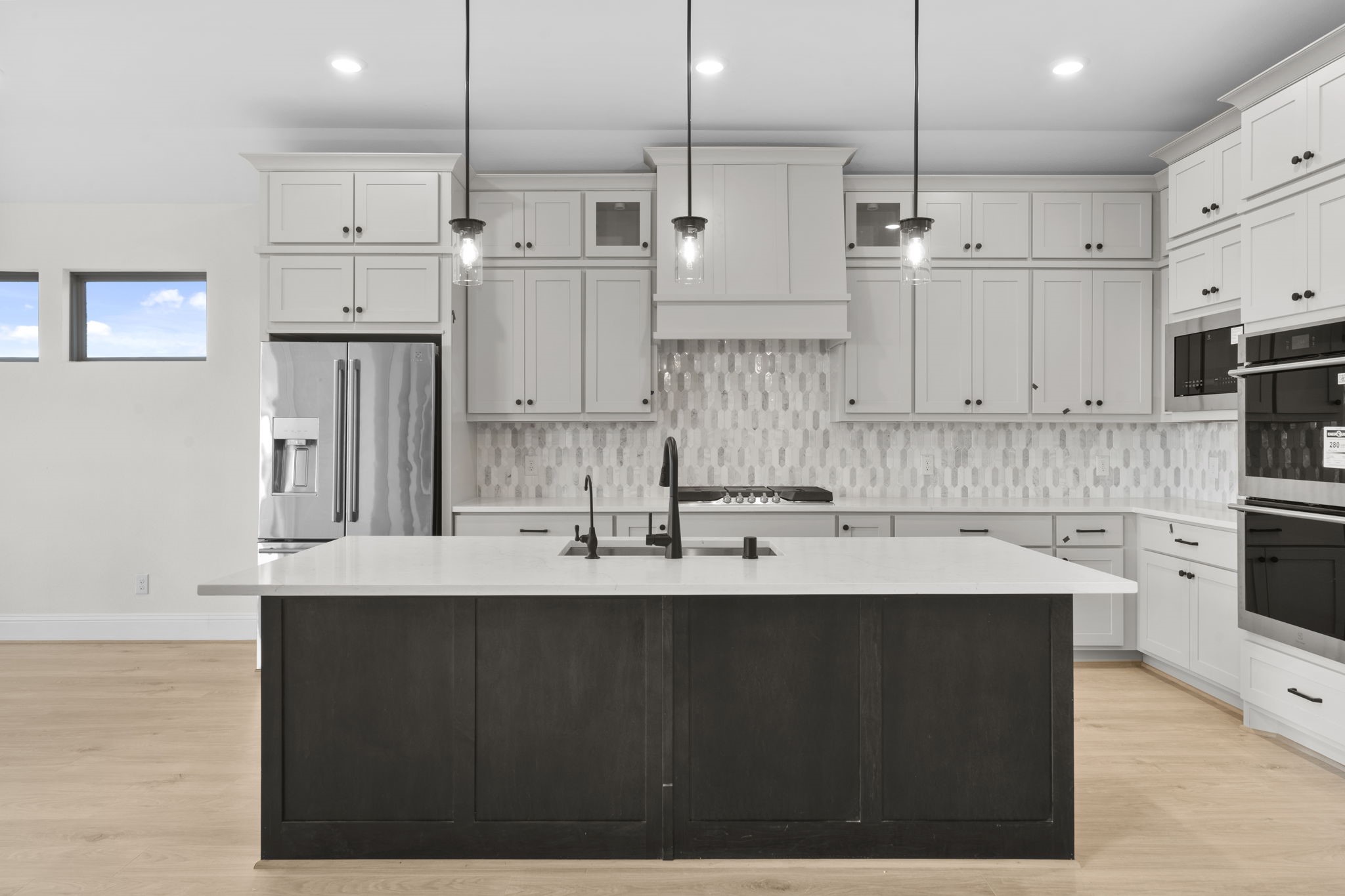 648 Cross Timbers Trace Hempstead, TX 77445 - Photo 4 of 40 a kitchen with stainless steel appliances kitchen island granite countertop a sink a center island and cabinets