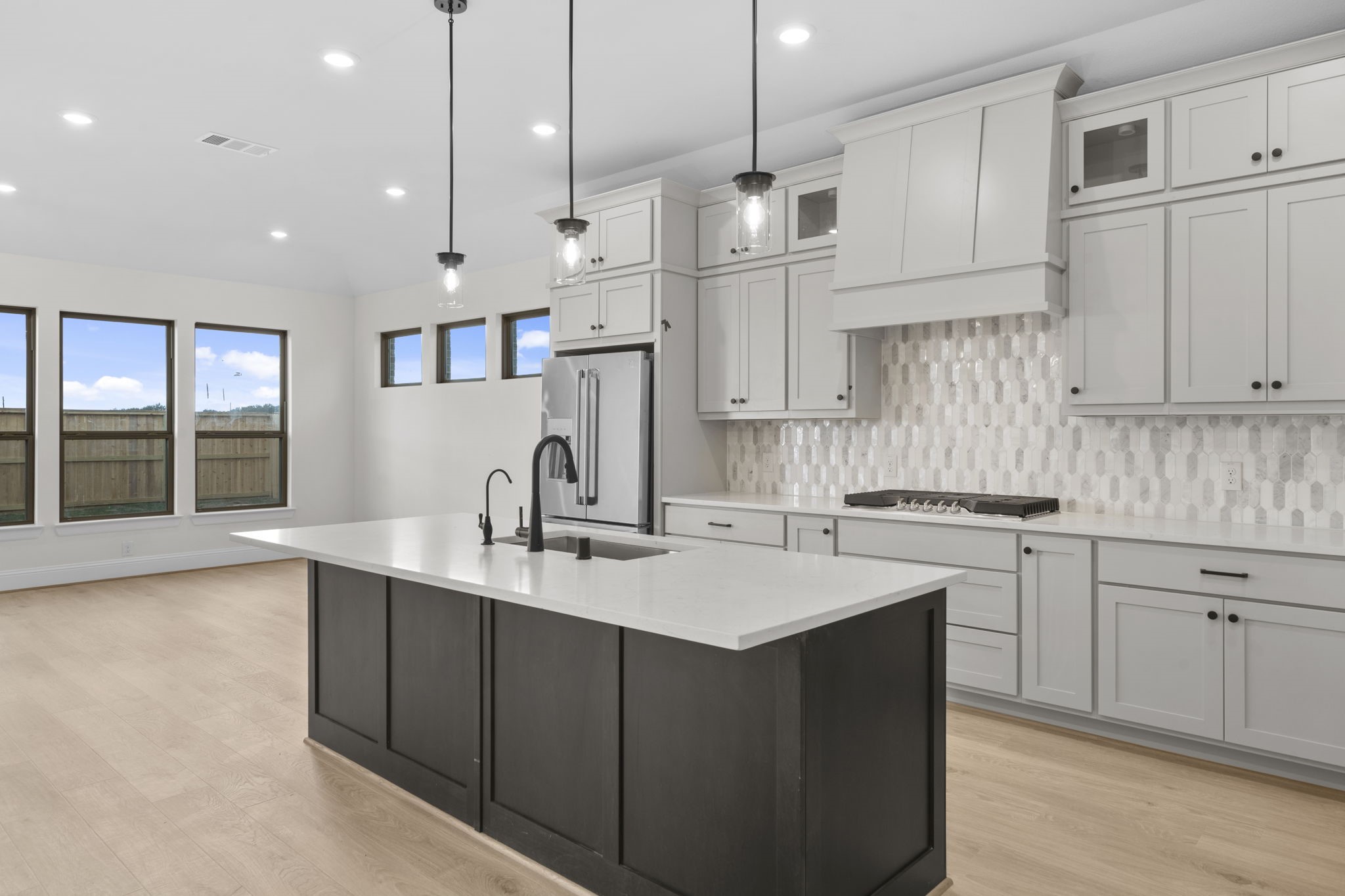 648 Cross Timbers Trace Hempstead, TX 77445 - Photo 5 of 40 an open kitchen with kitchen island a sink stainless steel appliances and cabinets