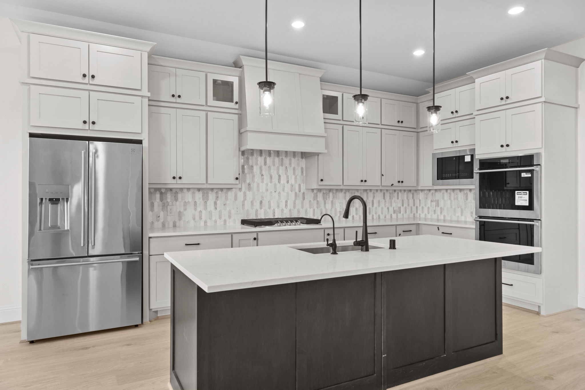 648 Cross Timbers Trace Hempstead, TX 77445 - Photo 6 of 40 a kitchen with stainless steel appliances a refrigerator sink and cabinets