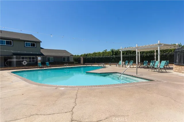 a view of a swimming pool with a patio