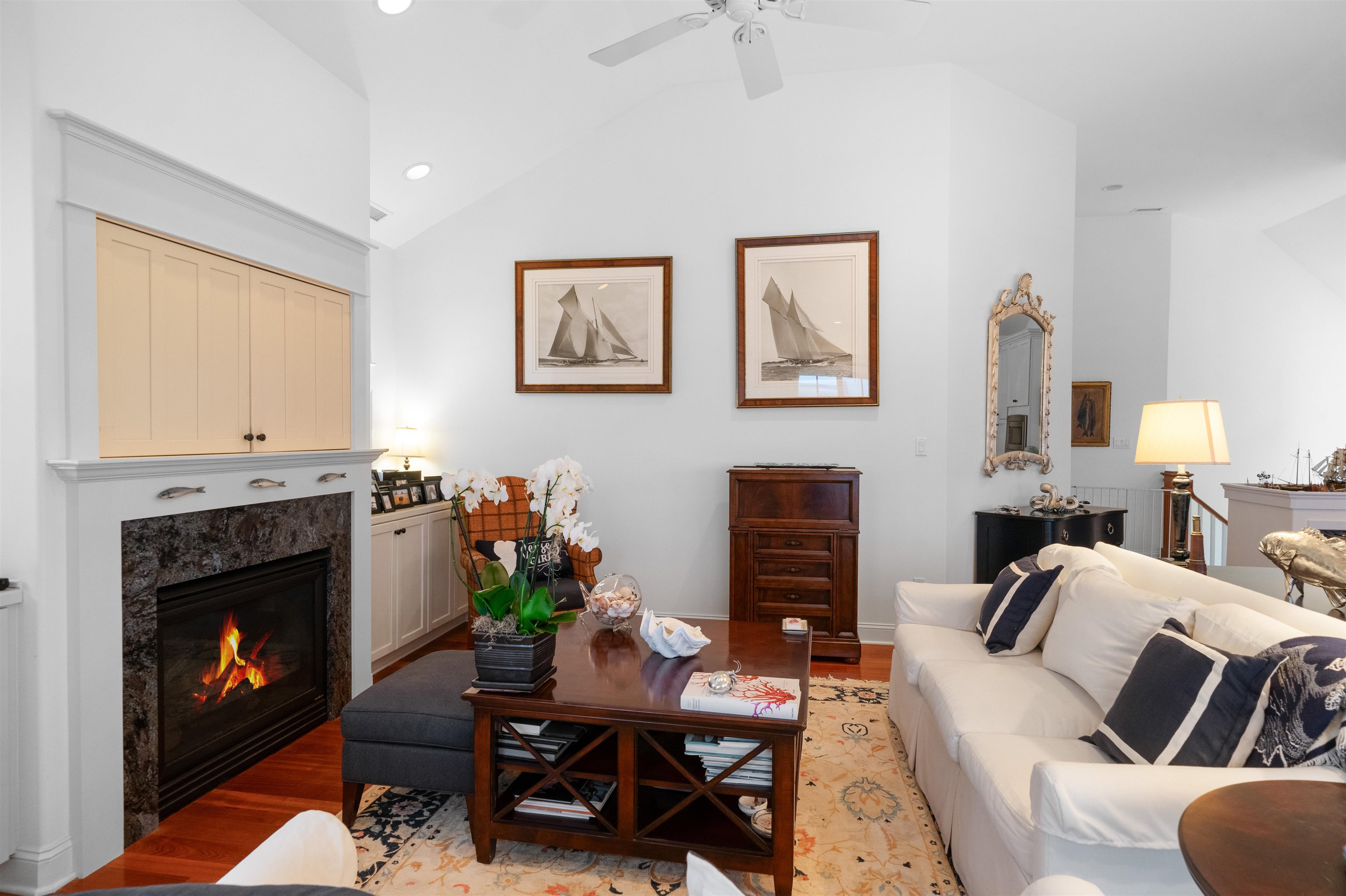 4765 4th Avalon, NJ 08202 - Photo 24 of 41 a living room with furniture a flat screen tv and a fireplace