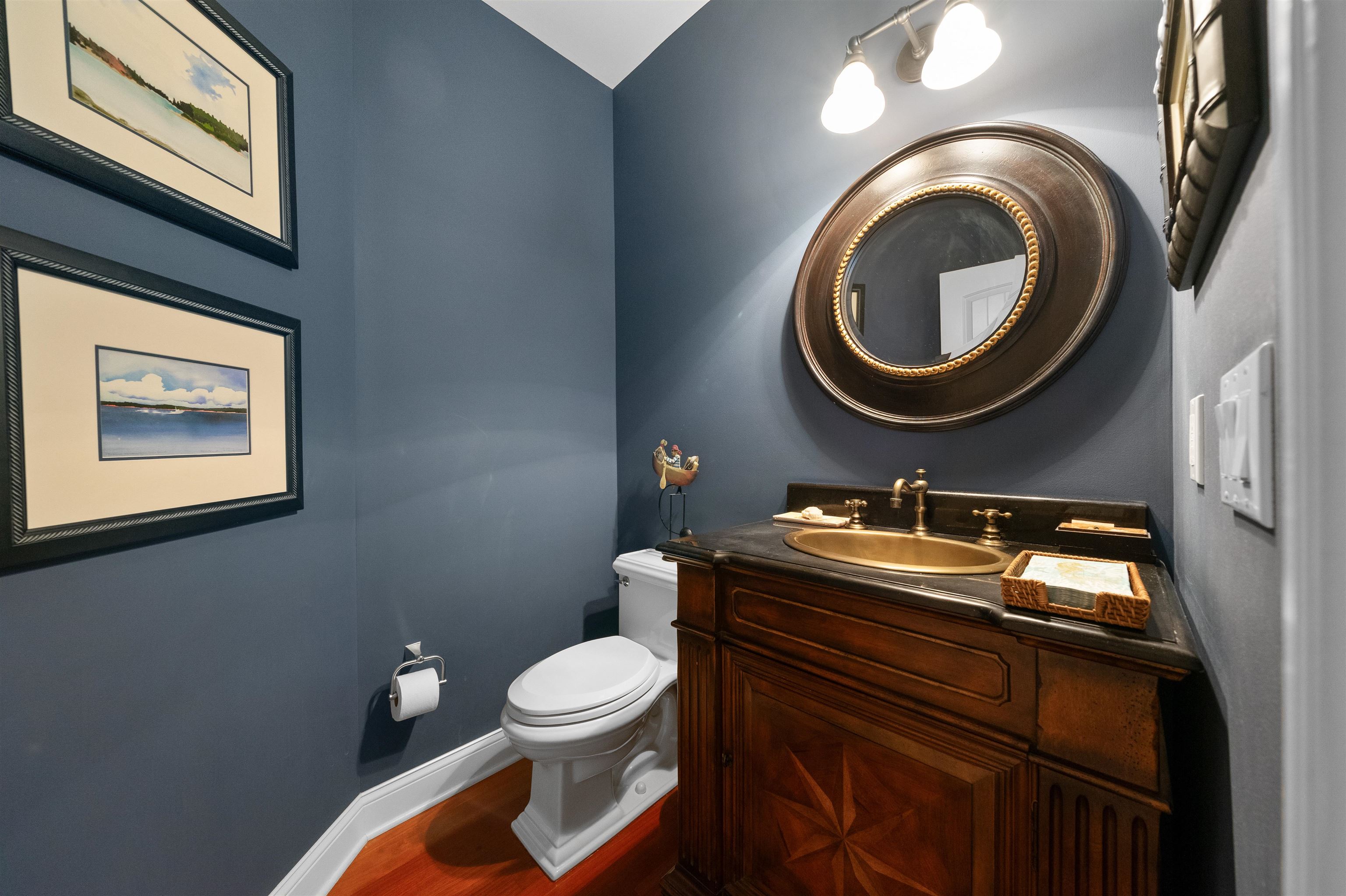 4765 4th Avalon, NJ 08202 - Photo 26 of 41 a bathroom with a toilet a sink and a mirror