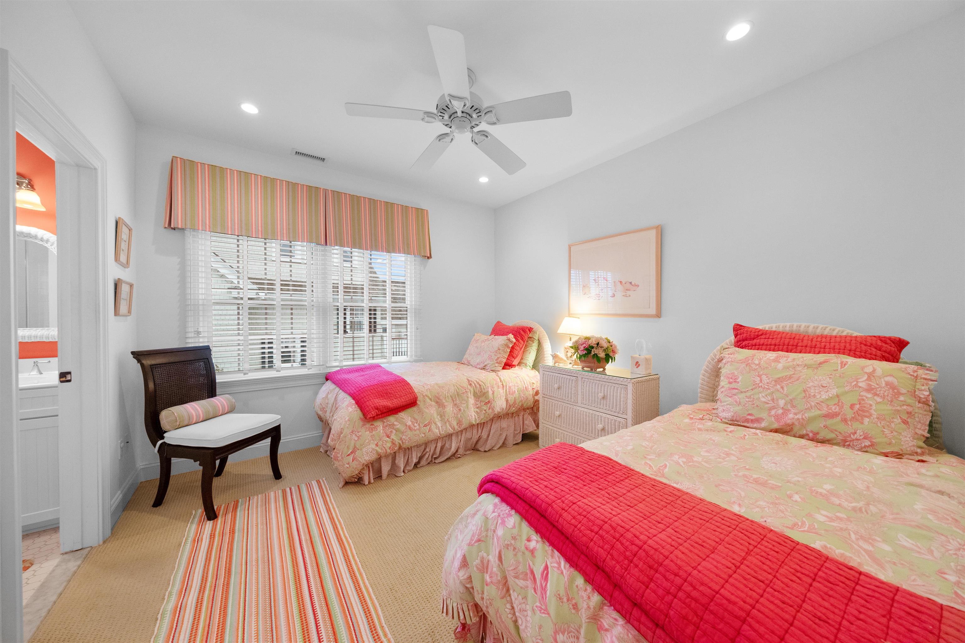 4765 4th Avalon, NJ 08202 - Photo 27 of 41 a bedroom with two beds and a chandelier