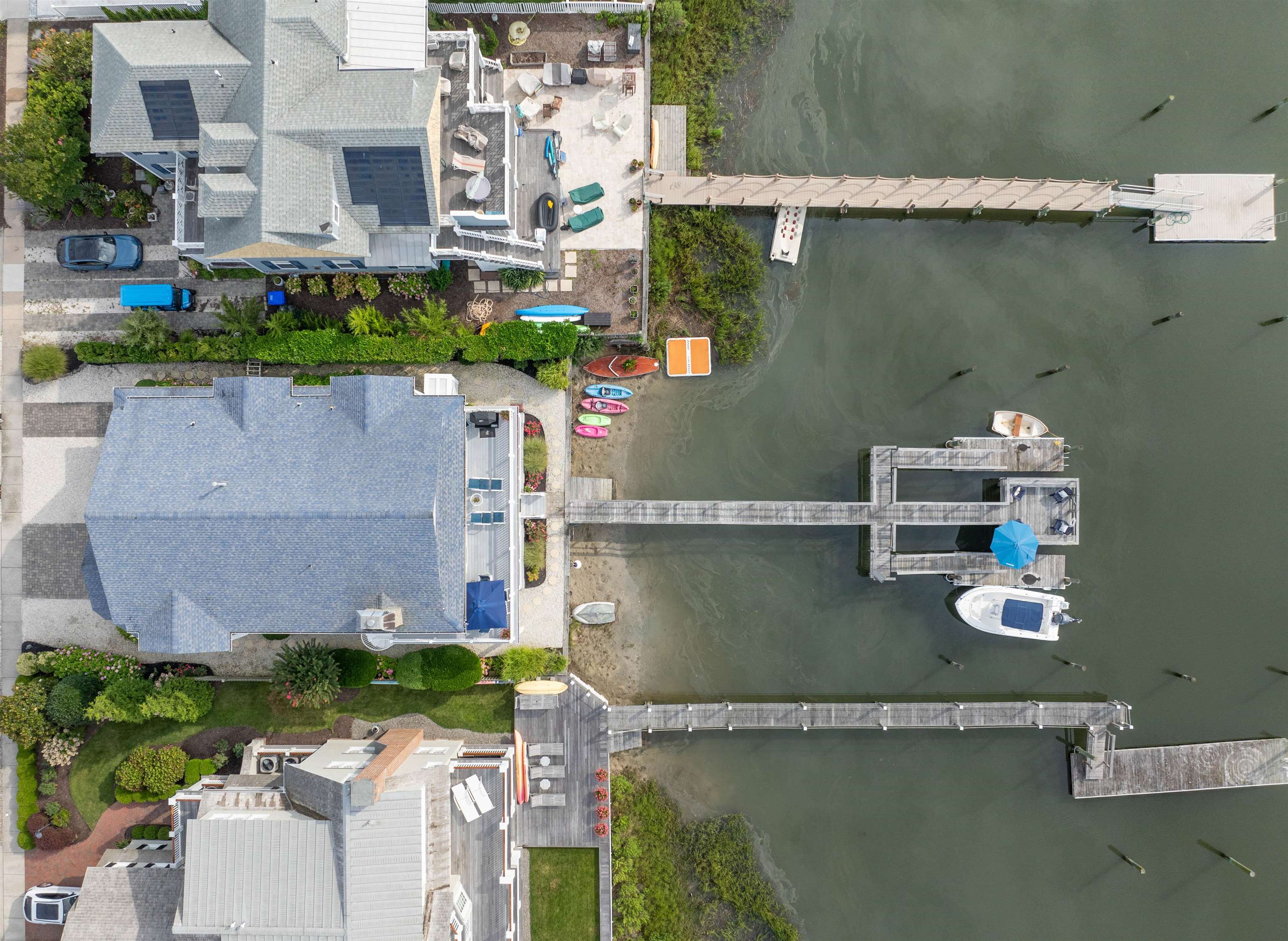 4765 4th Avalon, NJ 08202 - Photo 37 of 41 an aerial view of a house with a garden water fountain and large tree