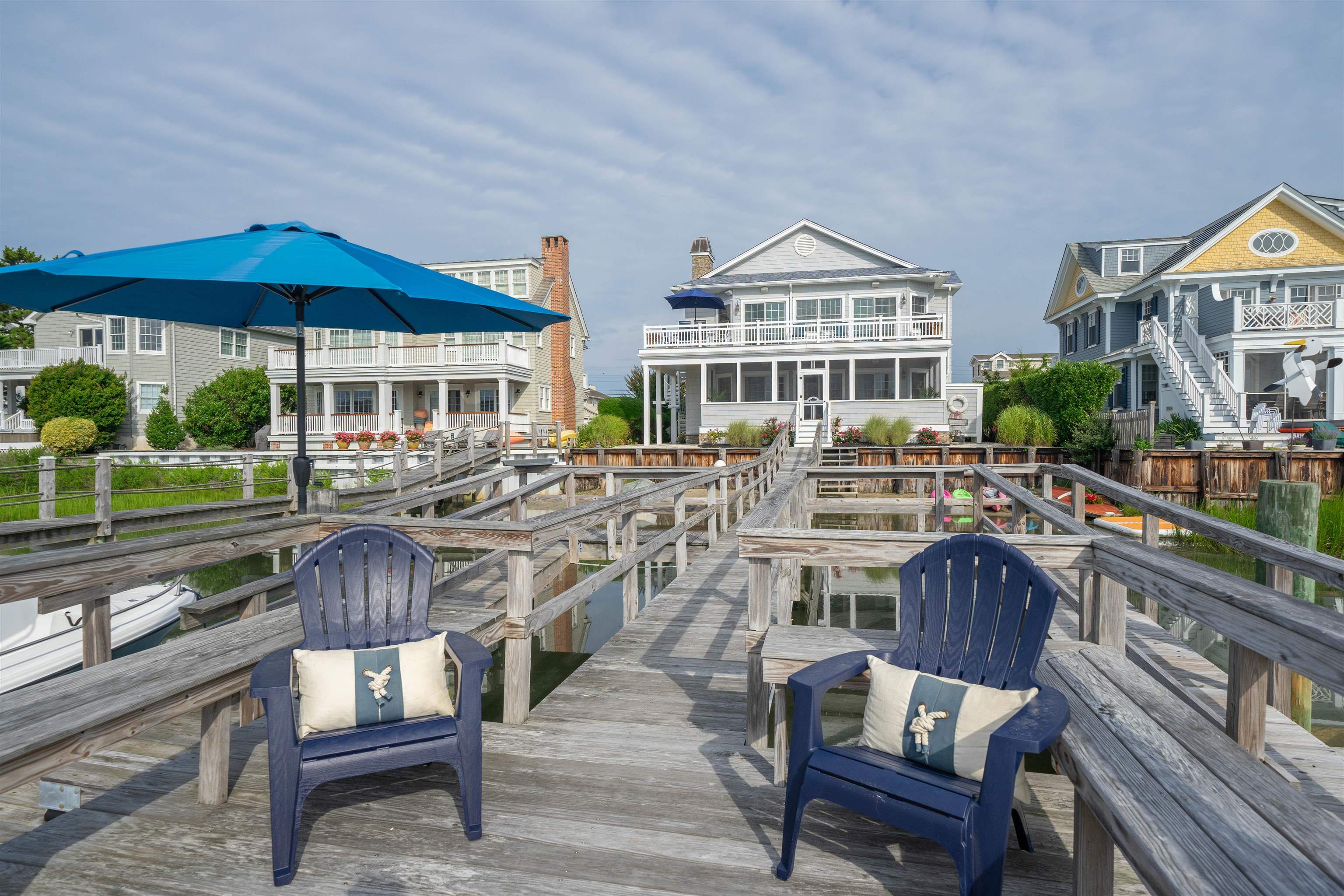 4765 4th Avalon, NJ 08202 - Photo 4 of 41 a view of a chairs and table in the patio in front of a house