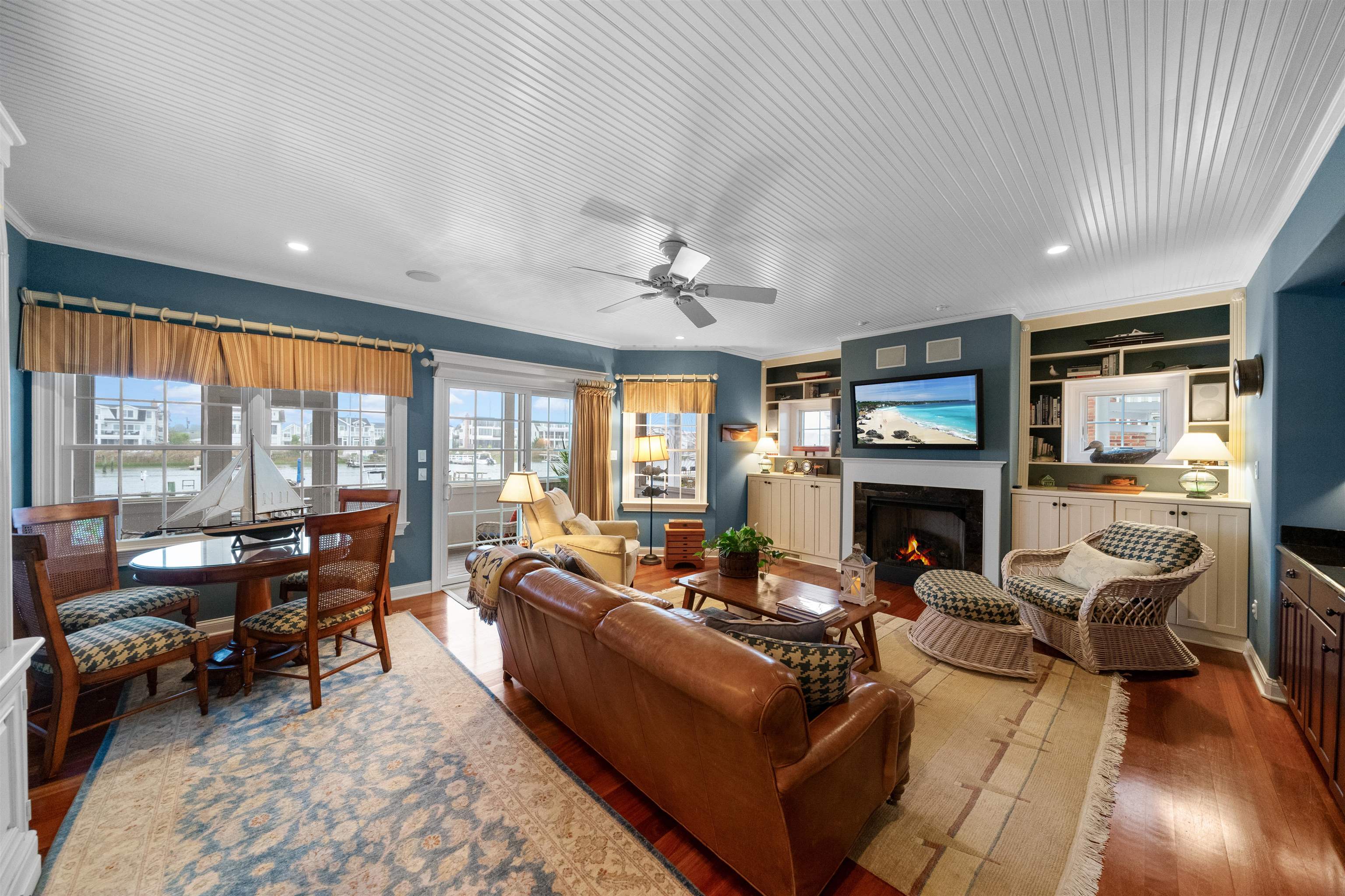4765 4th Avalon, NJ 08202 - Photo 8 of 41 a living room with furniture large windows and a fireplace
