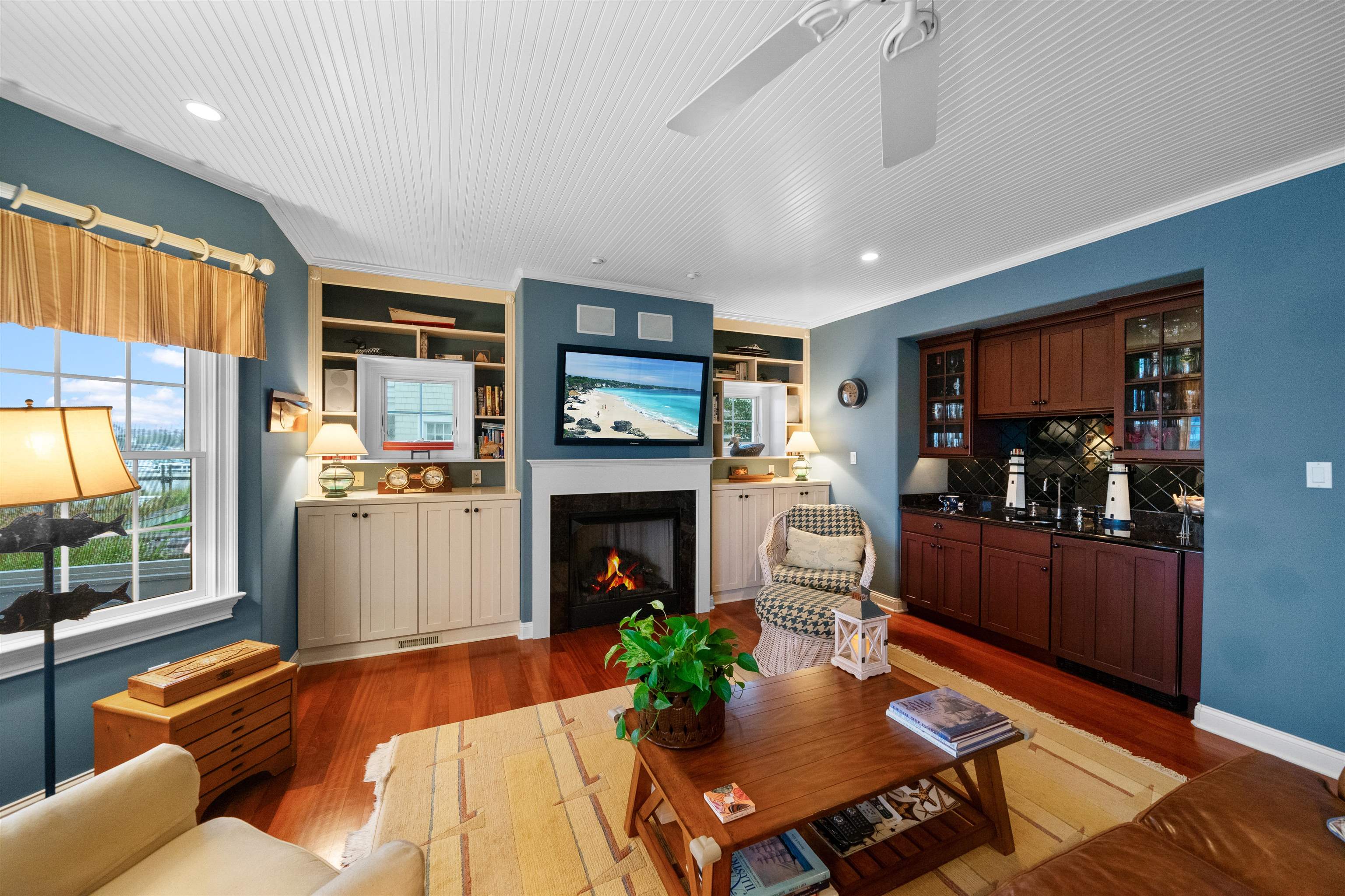 4765 4th Avalon, NJ 08202 - Photo 9 of 41 a living room with furniture and a fireplace