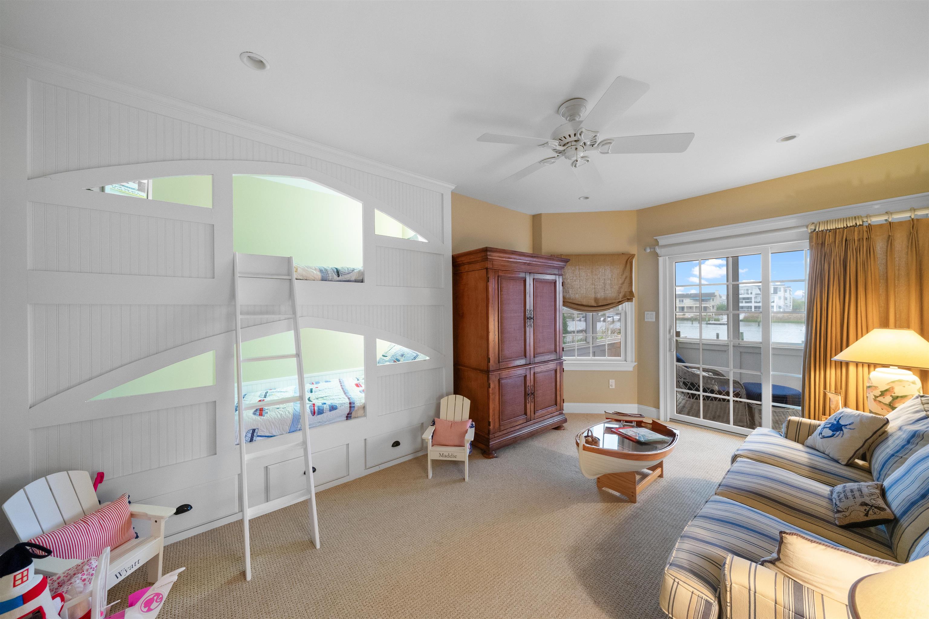 4765 4th Avalon, NJ 08202 - Photo 10 of 41 a living room with furniture and a floor to ceiling window