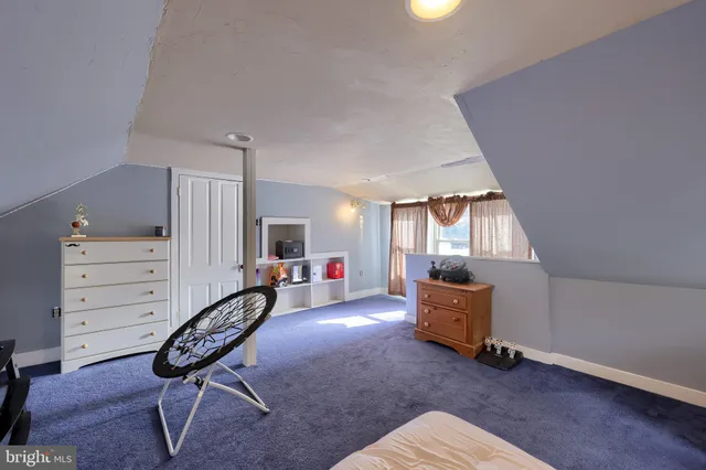 a livingroom with furniture and a window