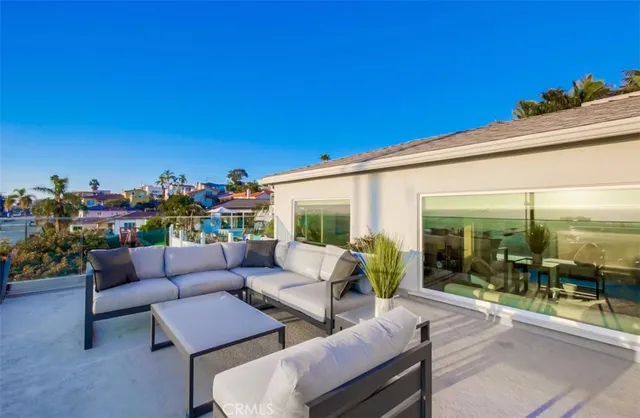 a living room with furniture and a large mirror