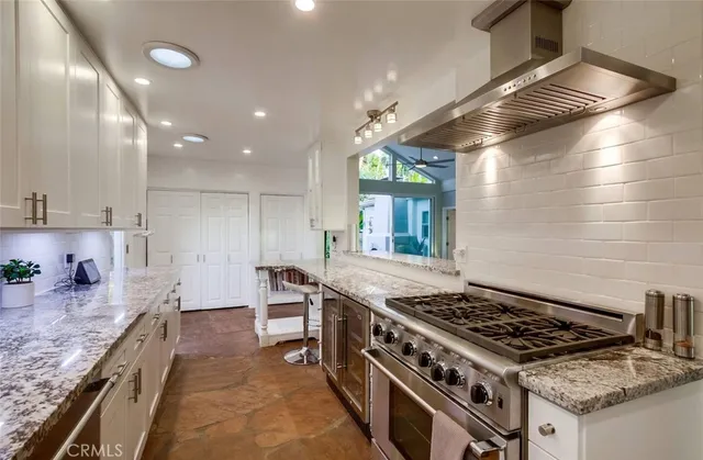 a bathroom with a double vanity sink toilet and shower