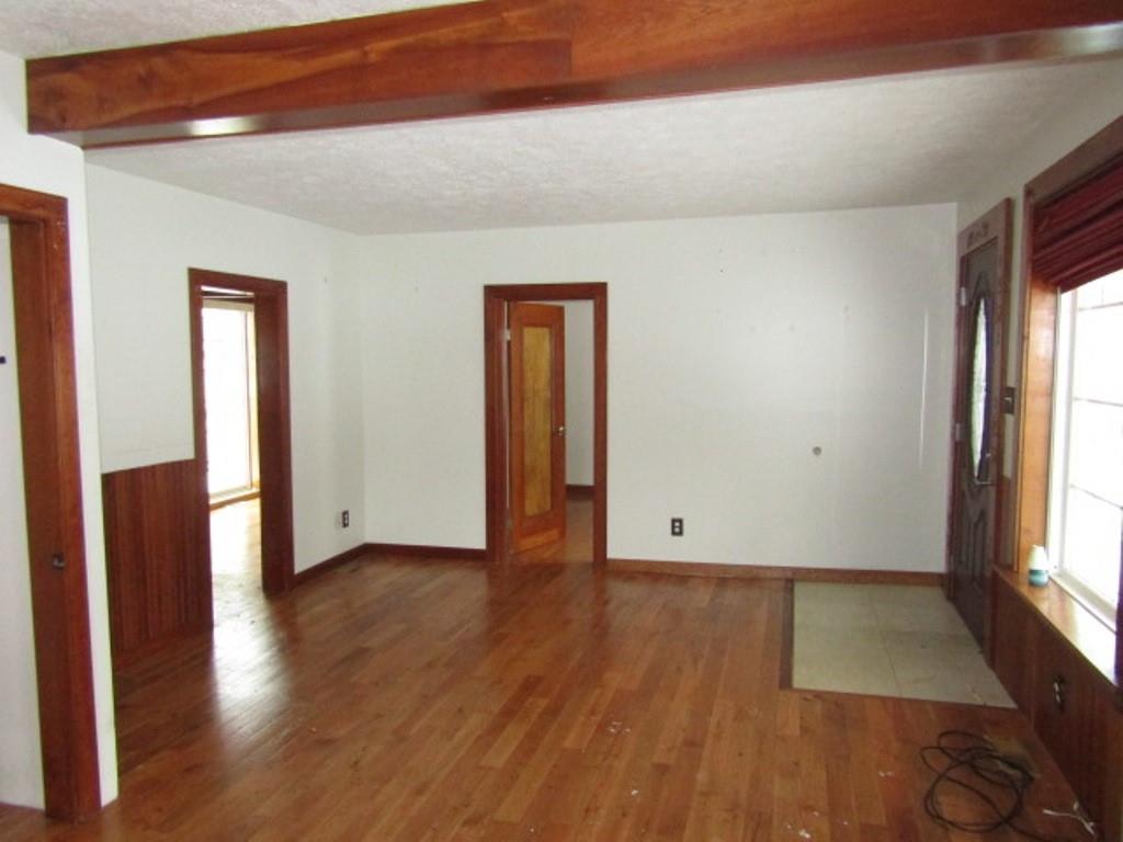 761 Highway 18 Burgettstown, PA 15021 - Photo 12 of 27 an empty room with wooden floor and windows