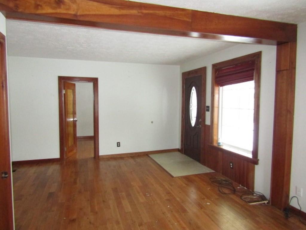 761 Highway 18 Burgettstown, PA 15021 - Photo 13 of 27 an empty room with wooden floor and a window