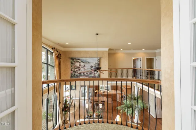 a bathroom with a sink a large mirror and a bathtub next to a window