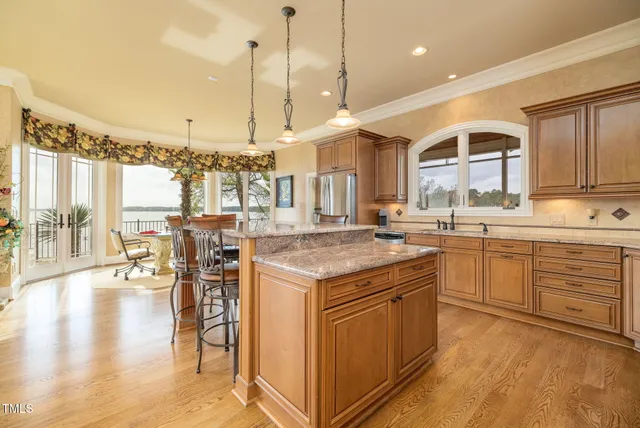 a spacious bedroom with a bed and a large window