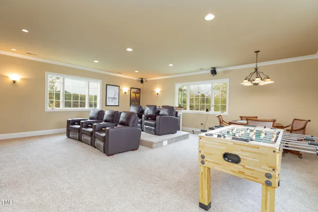 a view of a lake with table and chairs