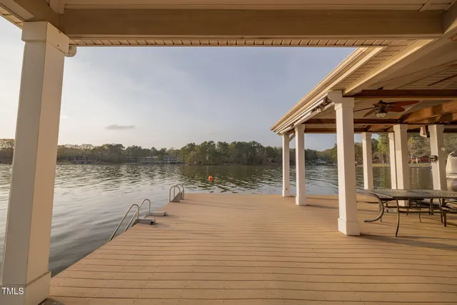 a balcony with furniture and a potted plant