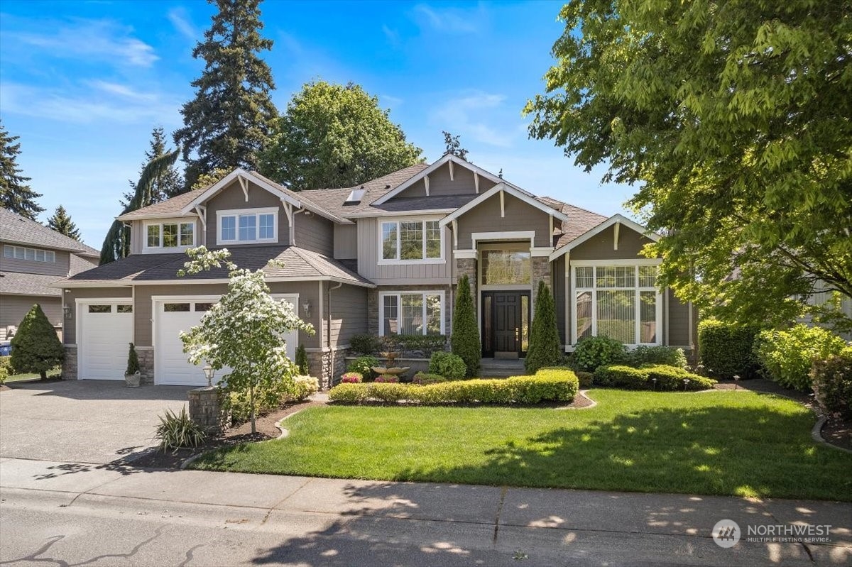 3808 209th Place Southeast Bothell, WA 98021 - Photo 1 of 5 a front view of a house with a yard