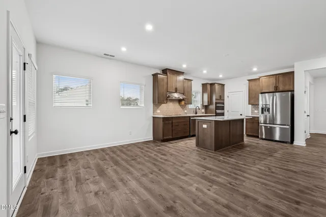 a view of kitchen with wooden floor