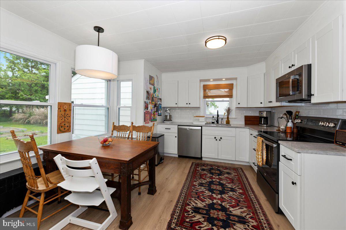 1708 Wrightfield Road Yardley, PA 19067 - Photo 13 of 41 a kitchen with a refrigerator and a stove top oven