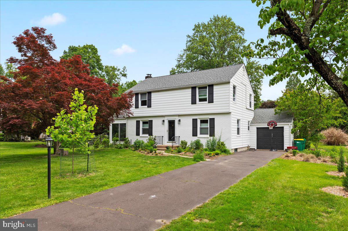 1708 Wrightfield Road Yardley, PA 19067 - Photo 2 of 41 a front view of a house with a garden and trees