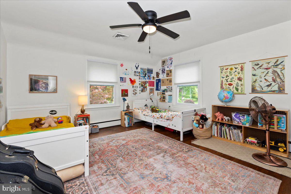 1708 Wrightfield Road Yardley, PA 19067 - Photo 28 of 41 a living room with lots of furniture and baby bed