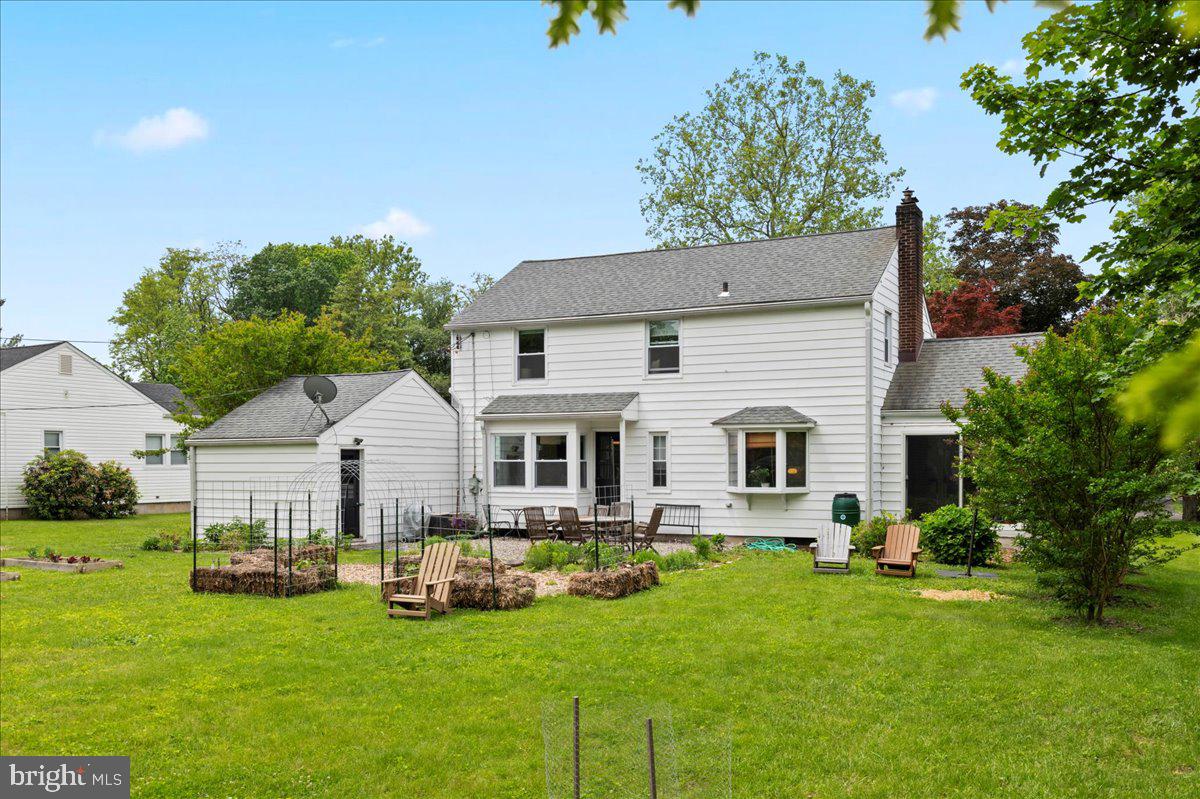 1708 Wrightfield Road Yardley, PA 19067 - Photo 34 of 41 a view of a house with backyard sitting area and garden