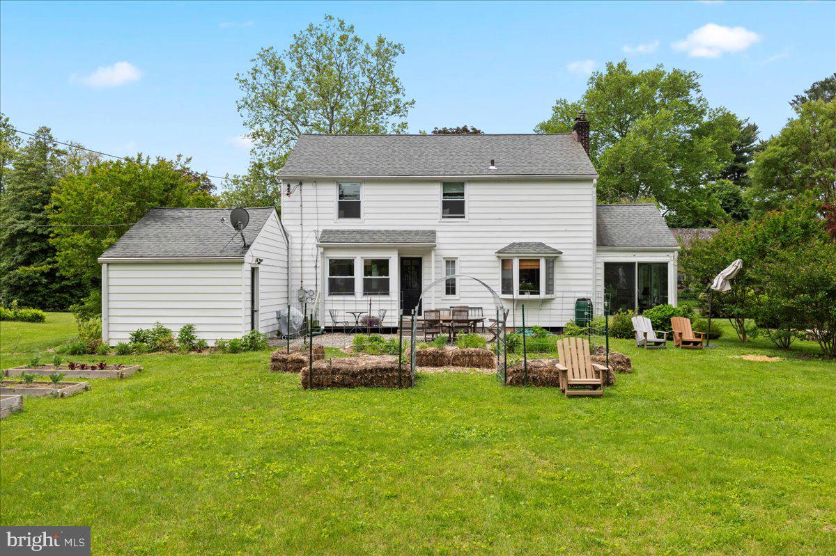 1708 Wrightfield Road Yardley, PA 19067 - Photo 35 of 41 a backyard of a house with table and chairs