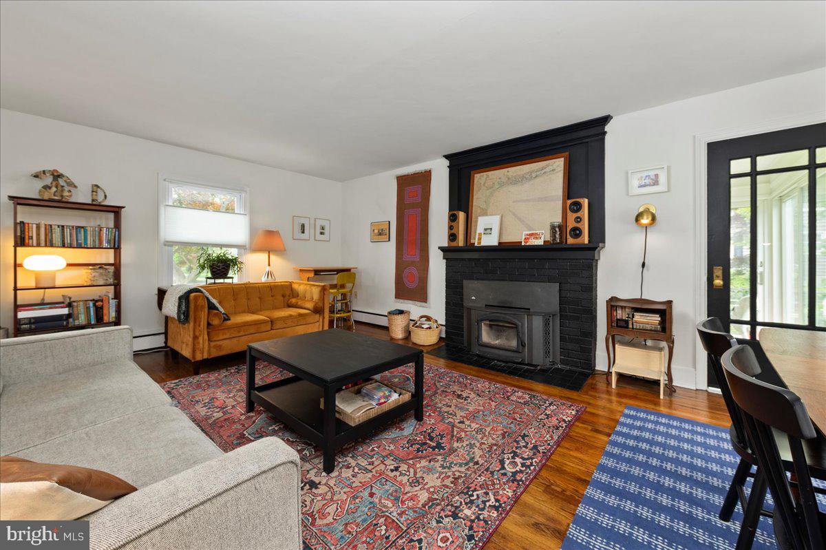 1708 Wrightfield Road Yardley, PA 19067 - Photo 7 of 41 a living room with furniture a flat screen tv and a fireplace