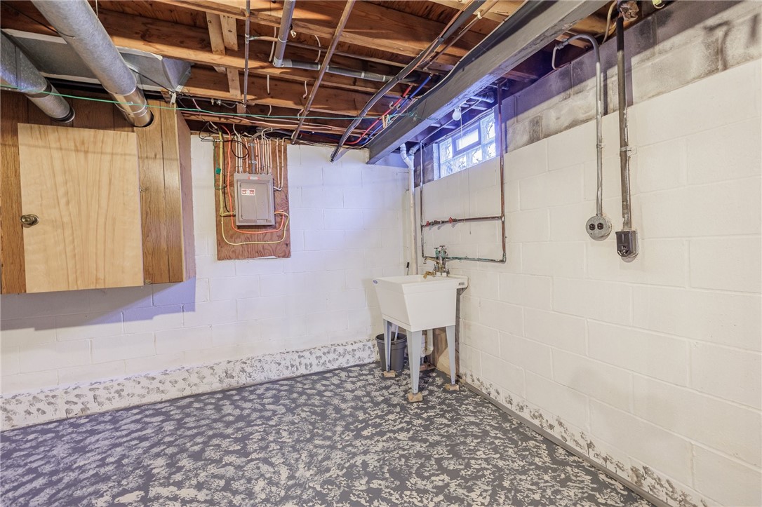 918 Copper Kettle Road Webster, NY 14580 - Photo 26 of 30 Utility sink & original laundry hook ups.