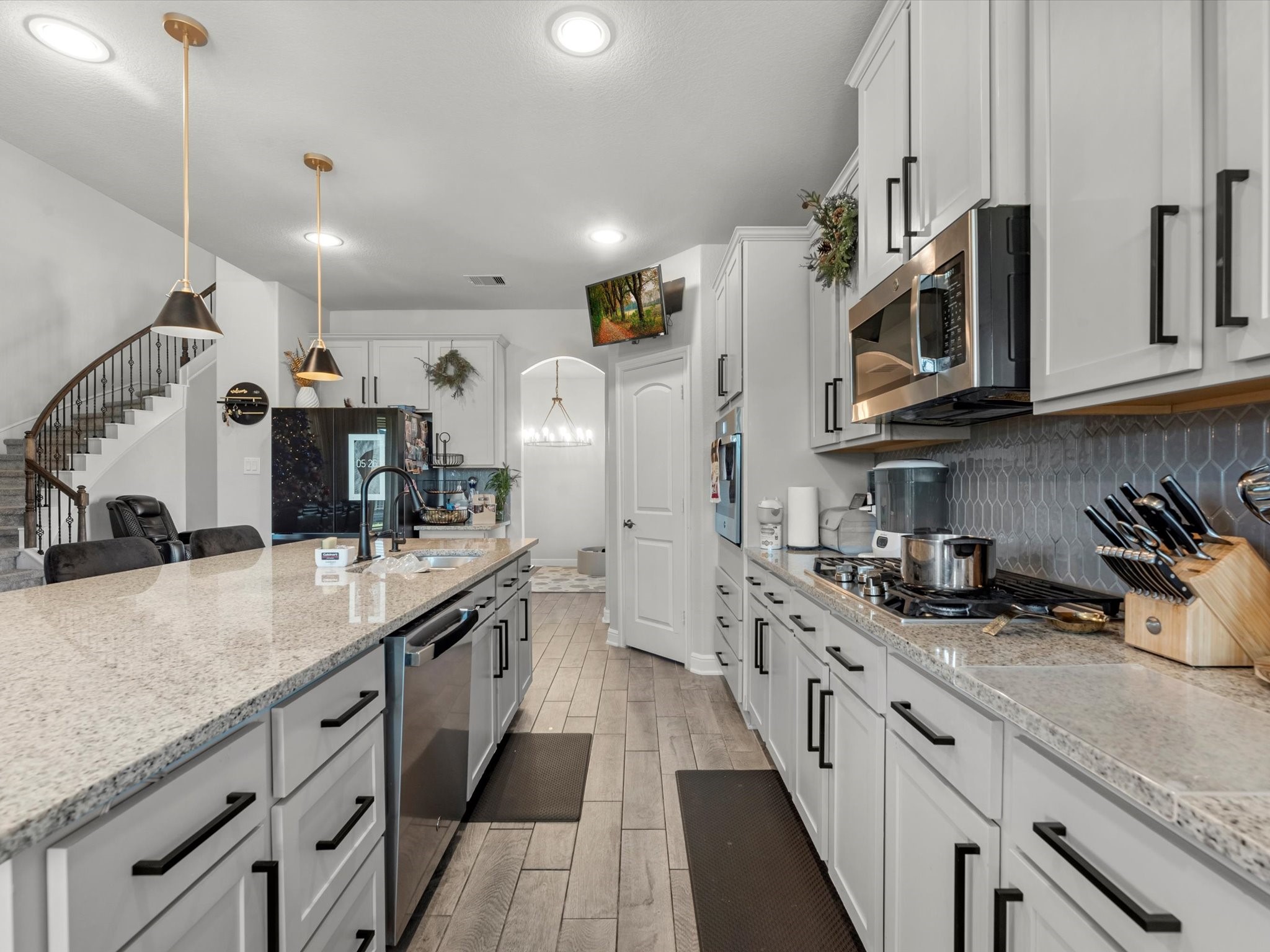 2822 Knotty Frst Drive Spring, TX 77373 - Photo 11 of 29 a large kitchen with stainless steel appliances granite countertop a lot of counter space and a sink