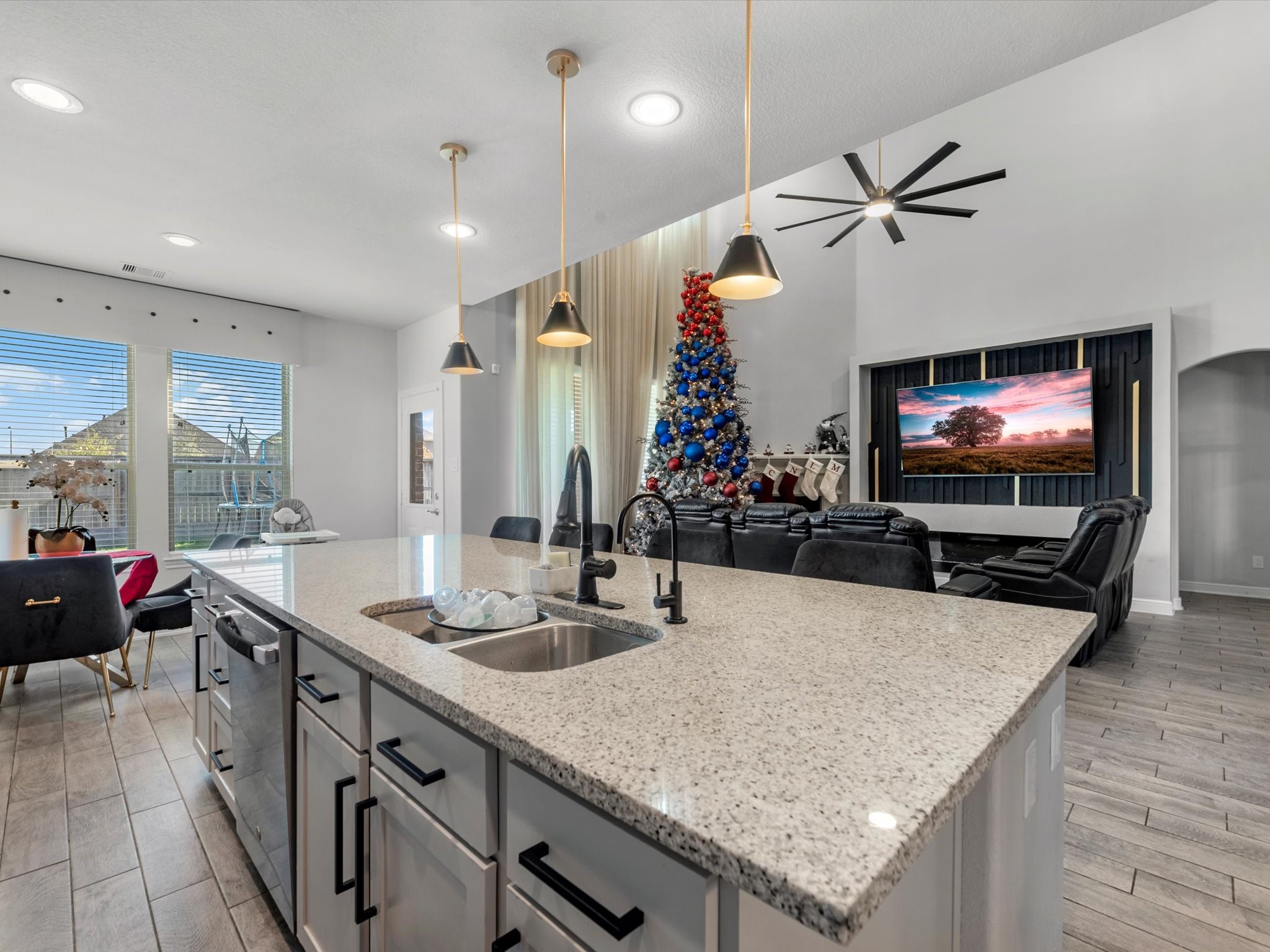 2822 Knotty Frst Drive Spring, TX 77373 - Photo 12 of 29 a kitchen with stainless steel appliances a sink a counter top space and living room view