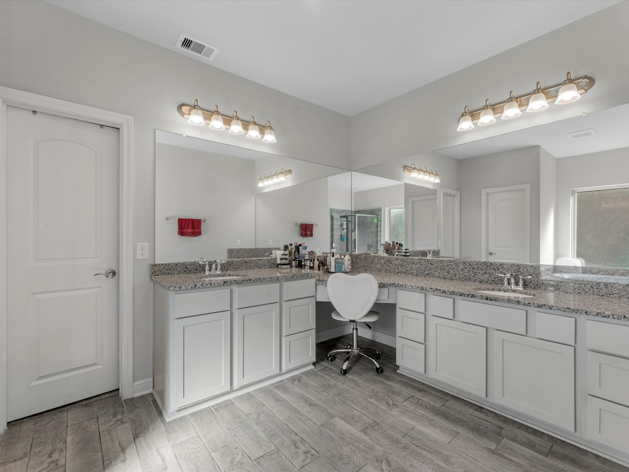2822 Knotty Frst Drive Spring, TX 77373 - Photo 20 of 29 a large white kitchen with a sink cabinets and living room view