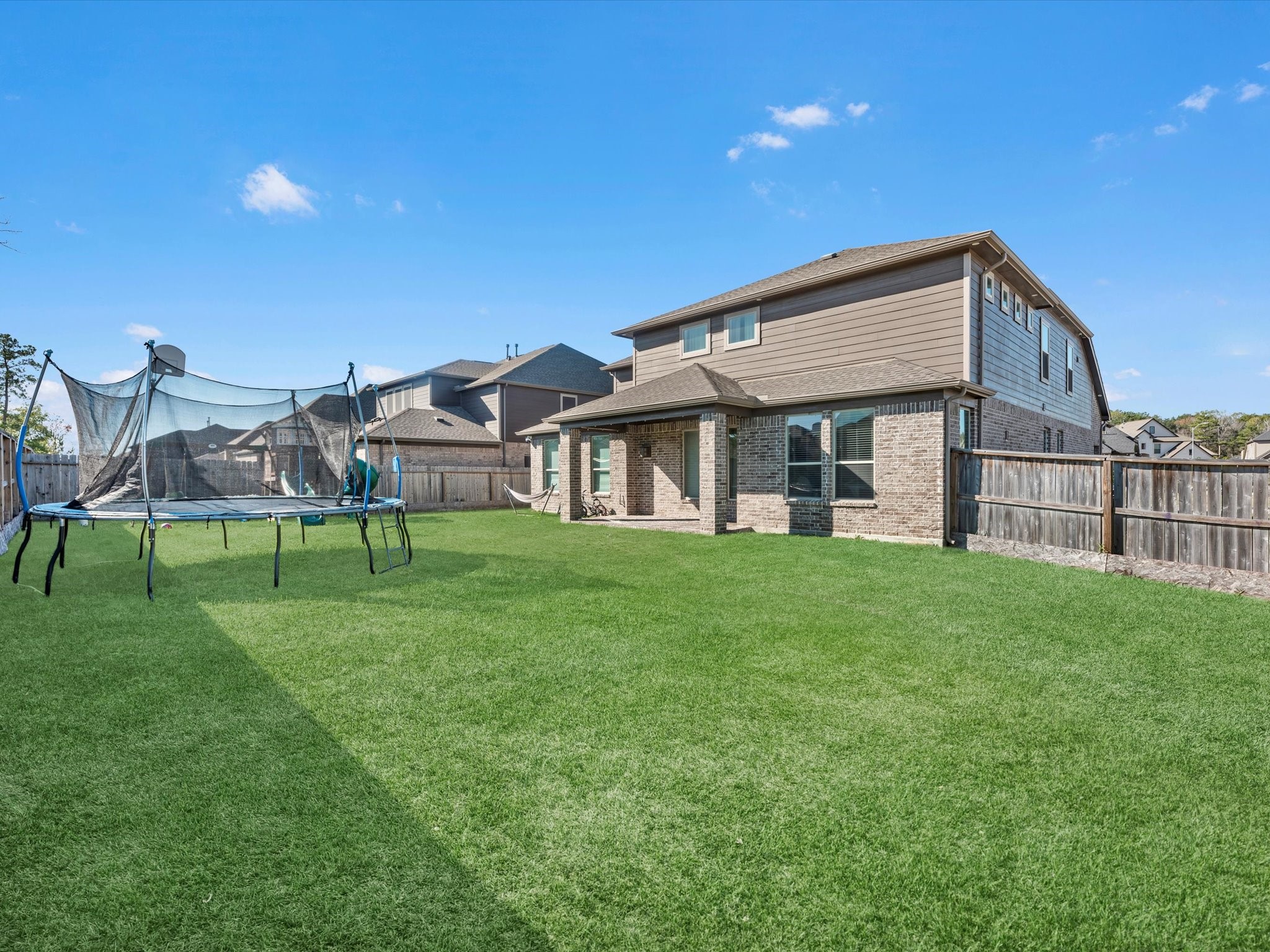 2822 Knotty Frst Drive Spring, TX 77373 - Photo 28 of 29 a view of a house with a backyard