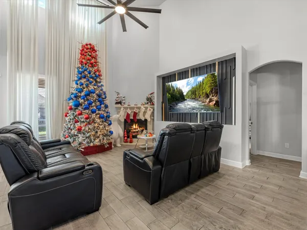 a living room with furniture and a flat screen tv
