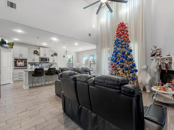 a living room with furniture and flowers