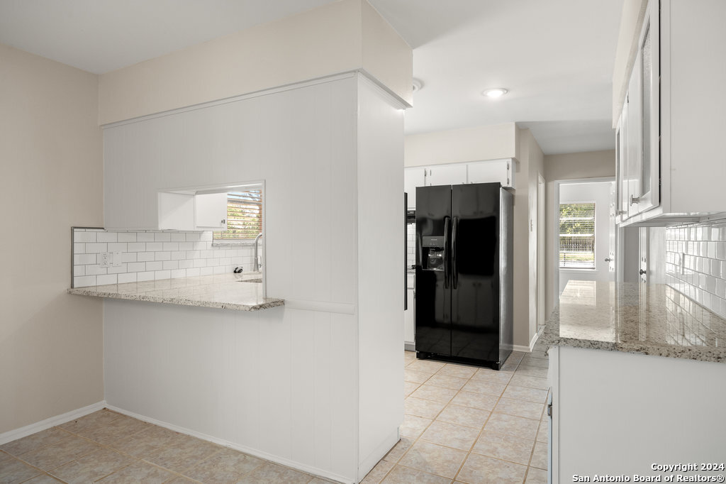 221 Windcrest Drive Windcrest, TX 78239 - Photo 11 of 28 a view of kitchen with furniture and refrigerator