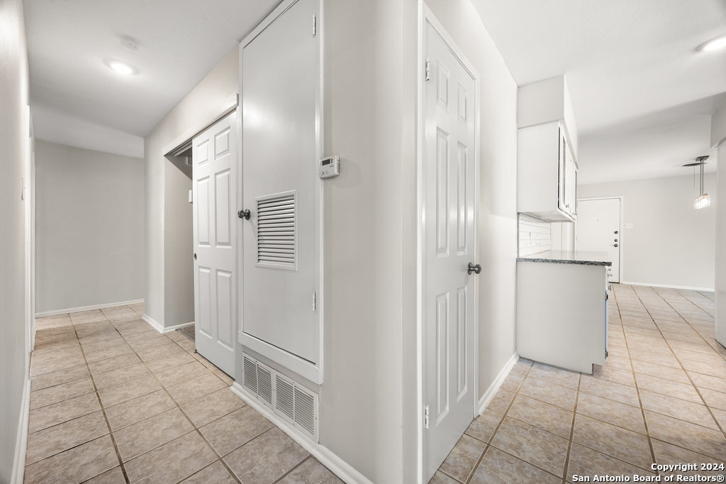 221 Windcrest Drive Windcrest, TX 78239 - Photo 20 of 28 a view of a refrigerator in kitchen and an empty room