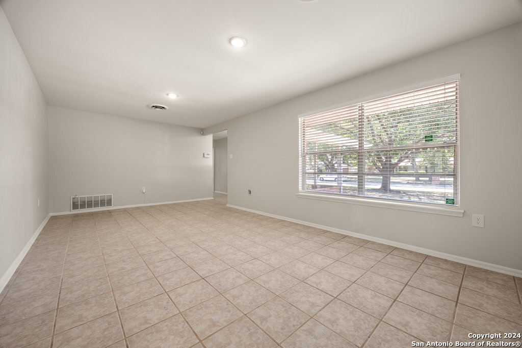 221 Windcrest Drive Windcrest, TX 78239 - Photo 8 of 28 a view of an empty room with a window
