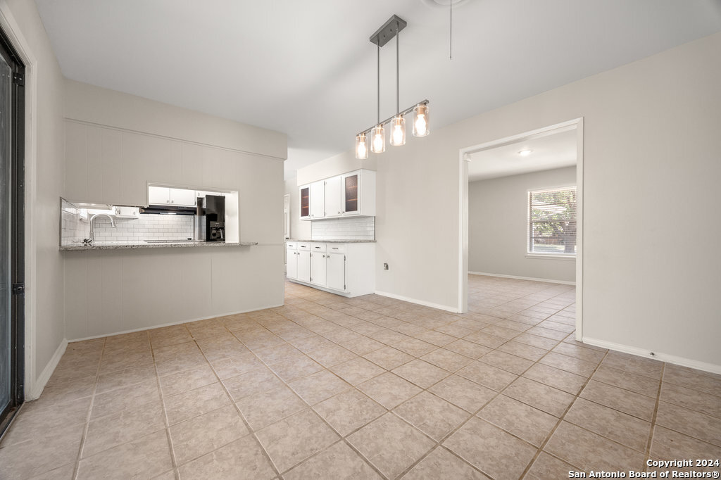 221 Windcrest Drive Windcrest, TX 78239 - Photo 10 of 28 a view of a kitchen with microwave and cabinets