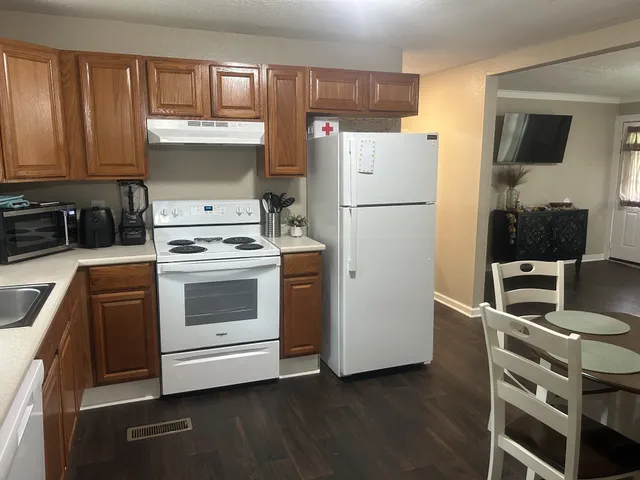 a kitchen with stainless steel appliances a refrigerator stove and sink