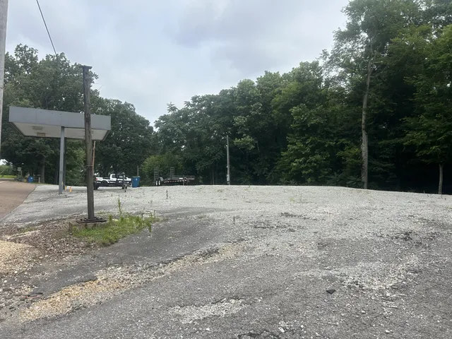 a view of a yard with a trampoline