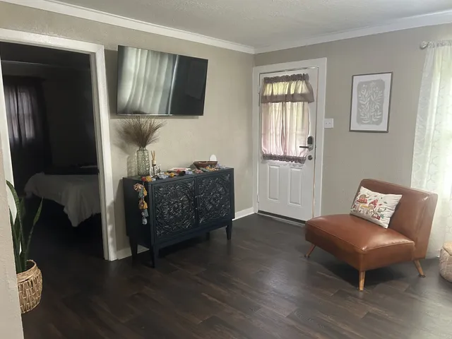 a living room with furniture and a window